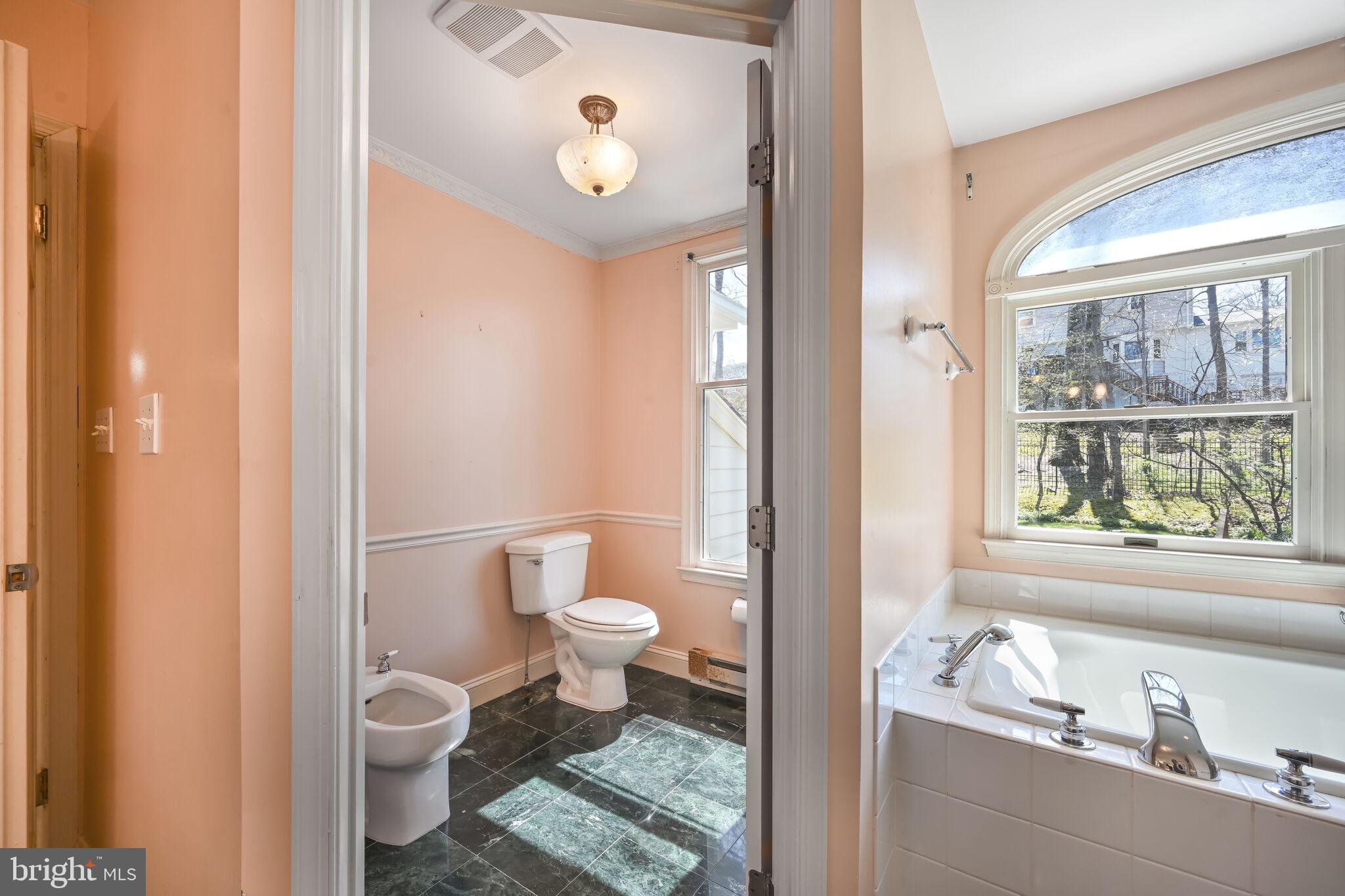 11337 Willowbrook Drive Rockville, MD 20854 - Photo 35 of 50 a bathroom with a sink toilet and tub