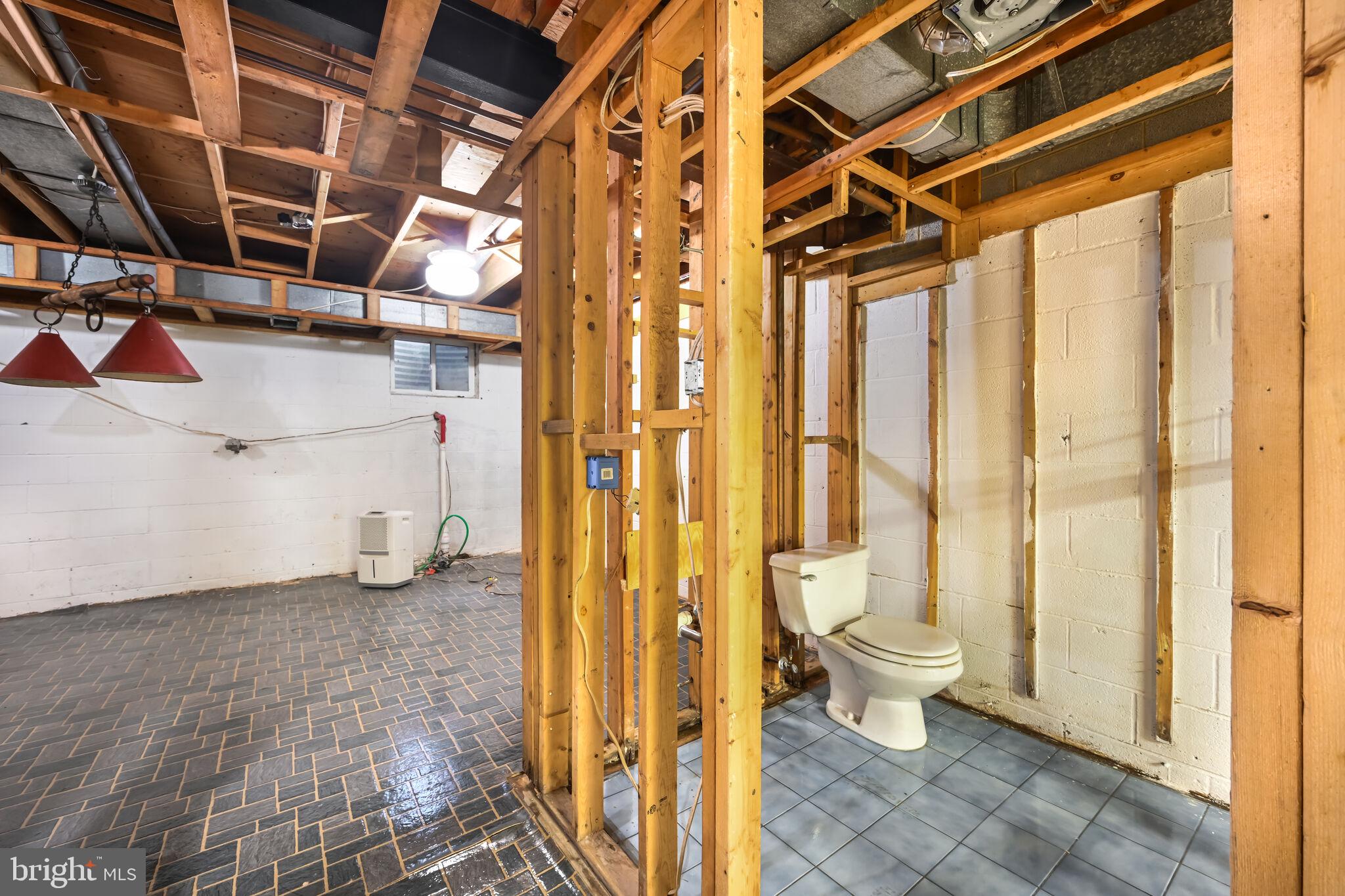 11337 Willowbrook Drive Rockville, MD 20854 - Photo 41 of 50 a view of a bathroom with a toilet and a shower