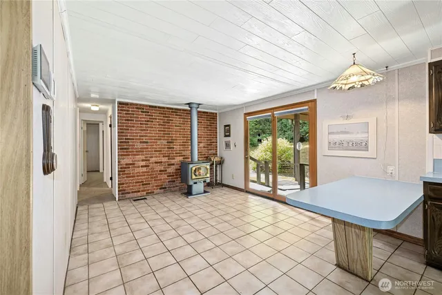 an empty room with closet and a chandelier fan