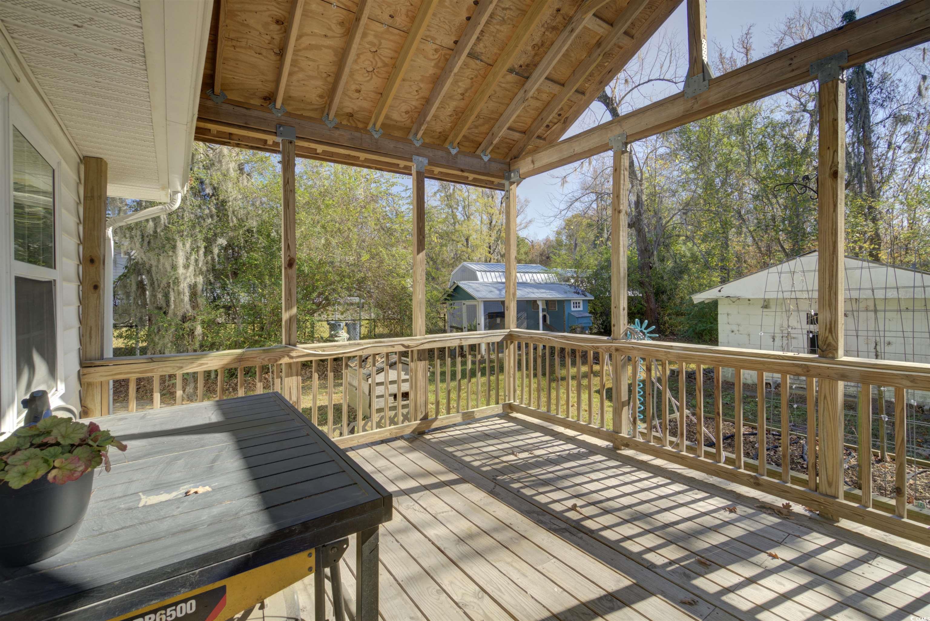 2080 Highway 90 Conway, SC 29526 - Photo 12 of 29 Deck featuring a storage shed and view of wooded area