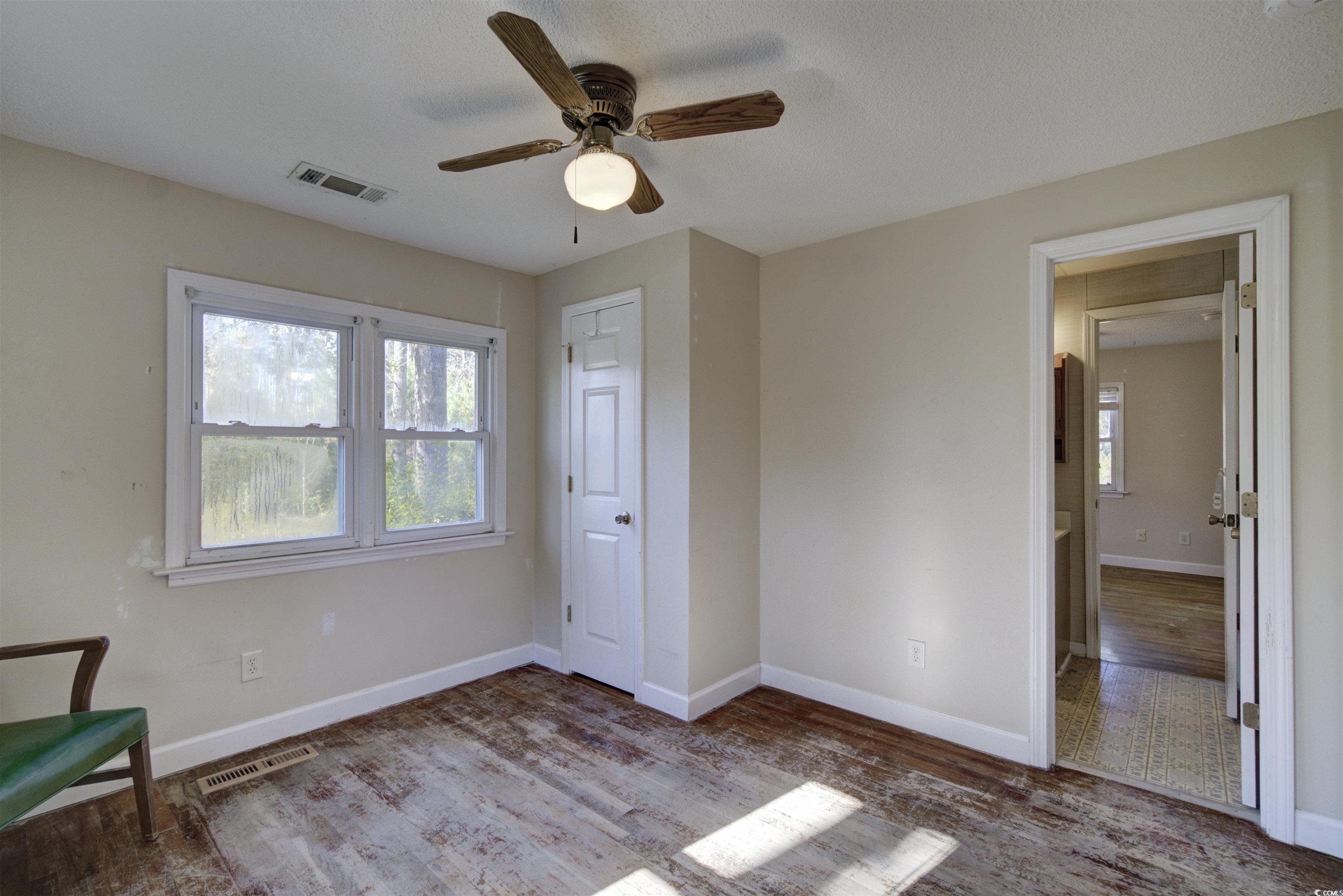 2080 Highway 90 Conway, SC 29526 - Photo 18 of 29 Unfurnished bedroom with wood finished floors and ceiling fan