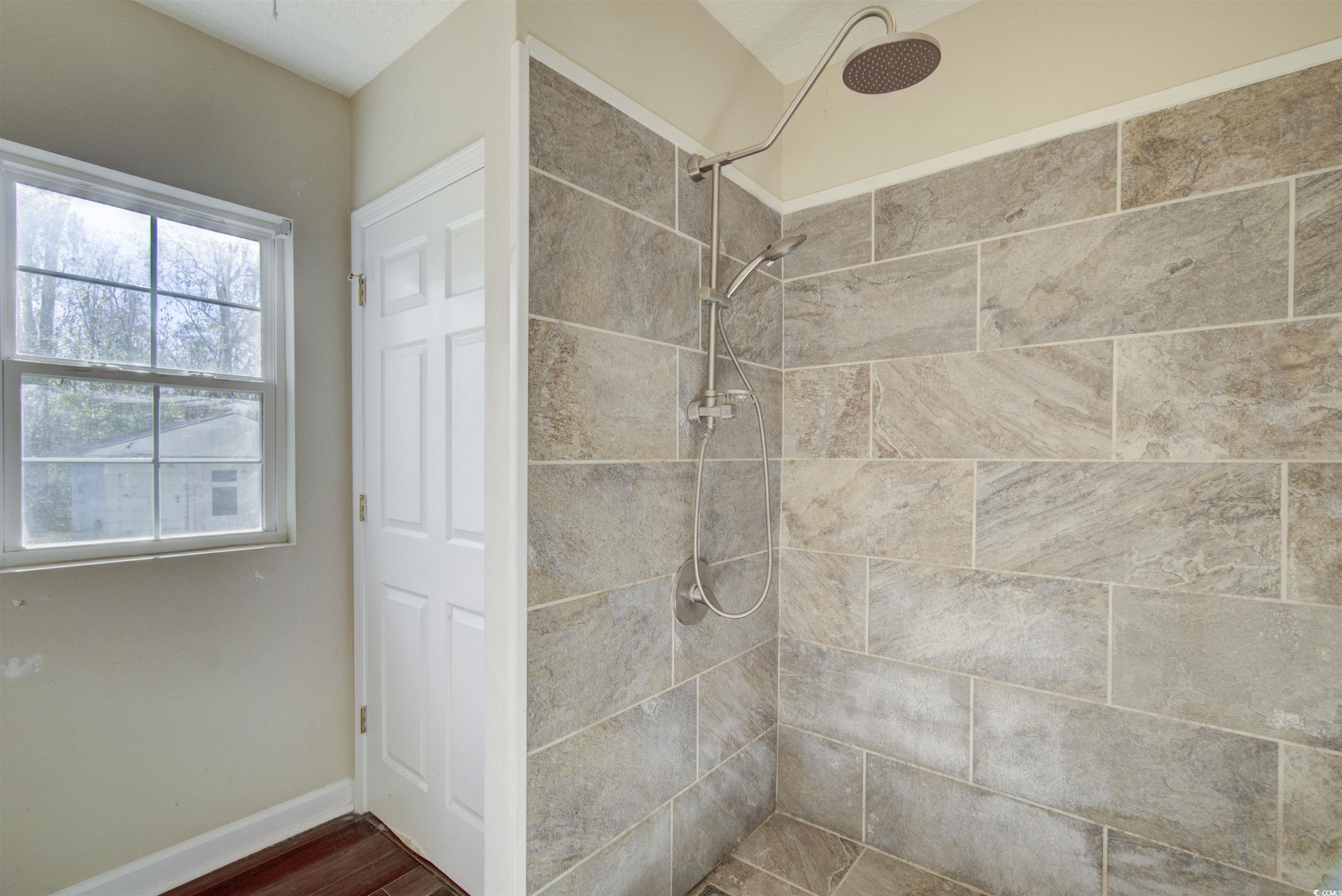 2080 Highway 90 Conway, SC 29526 - Photo 27 of 29 Full bath with a tile shower and dark wood-type flooring