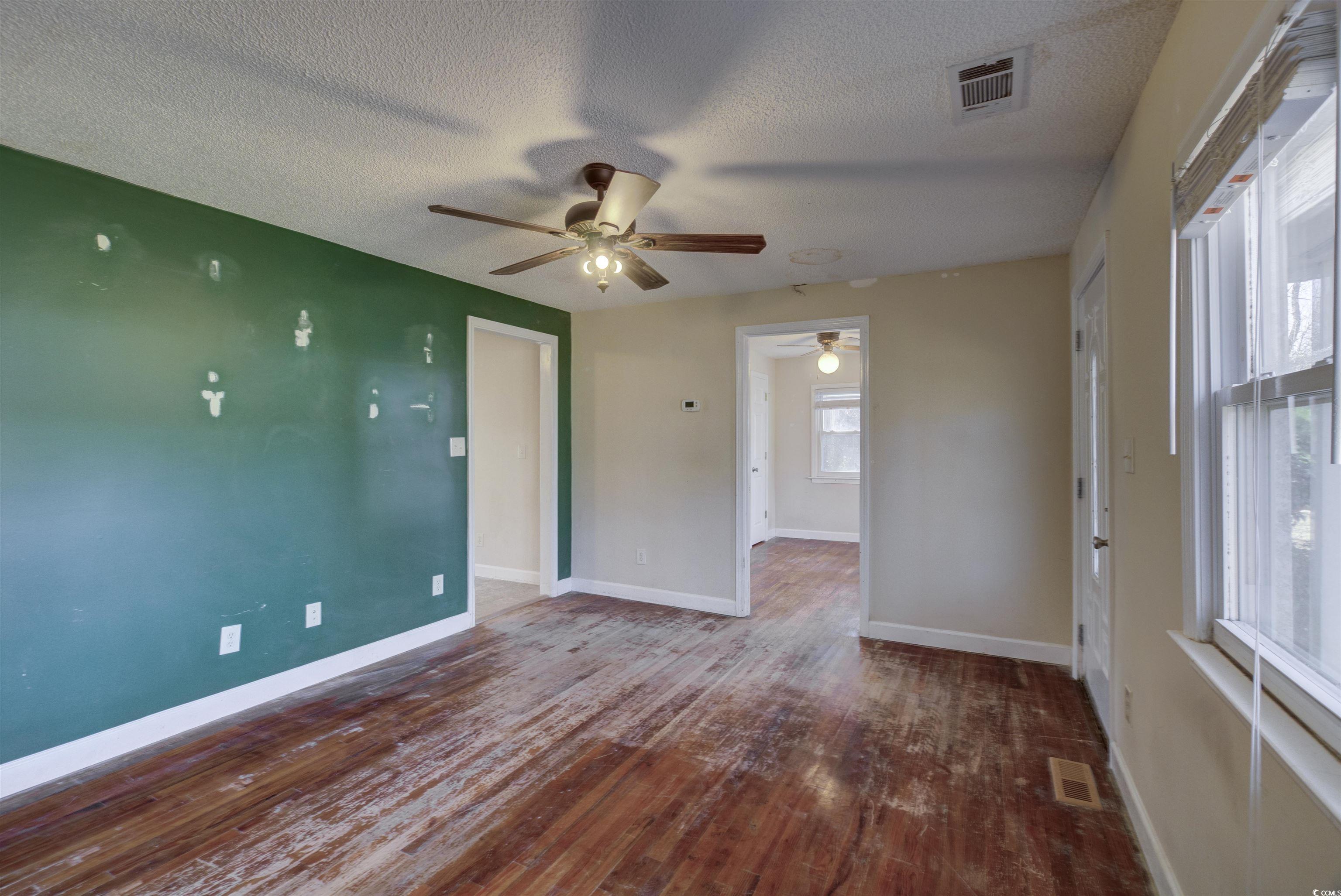 2080 Highway 90 Conway, SC 29526 - Photo 5 of 29 Unfurnished room featuring a textured ceiling and dark wood-style floors