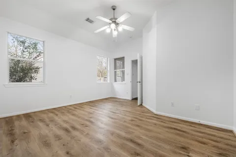a bathroom with a sink toilet vanity and shower