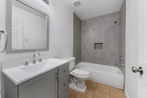 a bathroom with a bathtub and a sink