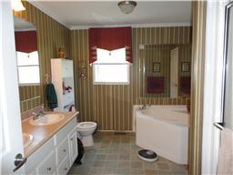 299 Knott Road Winchester, TN 37398 - Photo 14 of 20 The spacious master bath has double vanities, garden tub, large walk in closet and seperate shower and tub.