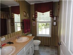 299 Knott Road Winchester, TN 37398 - Photo 15 of 20 Guest bathroom has a double vanity and linen closet.