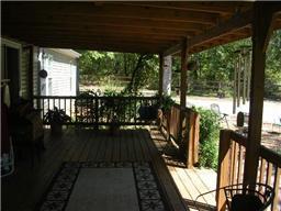 299 Knott Road Winchester, TN 37398 - Photo 18 of 20 A large covered deck with kitchen access and convenient to the patio and parking area.
