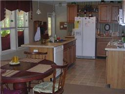 299 Knott Road Winchester, TN 37398 - Photo 8 of 20 The kitchen includes an island with dishwasher and sink.