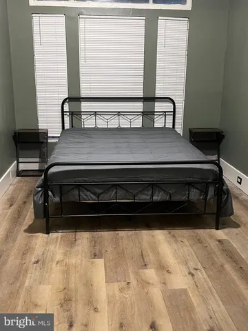 a black and white photo of a bedroom