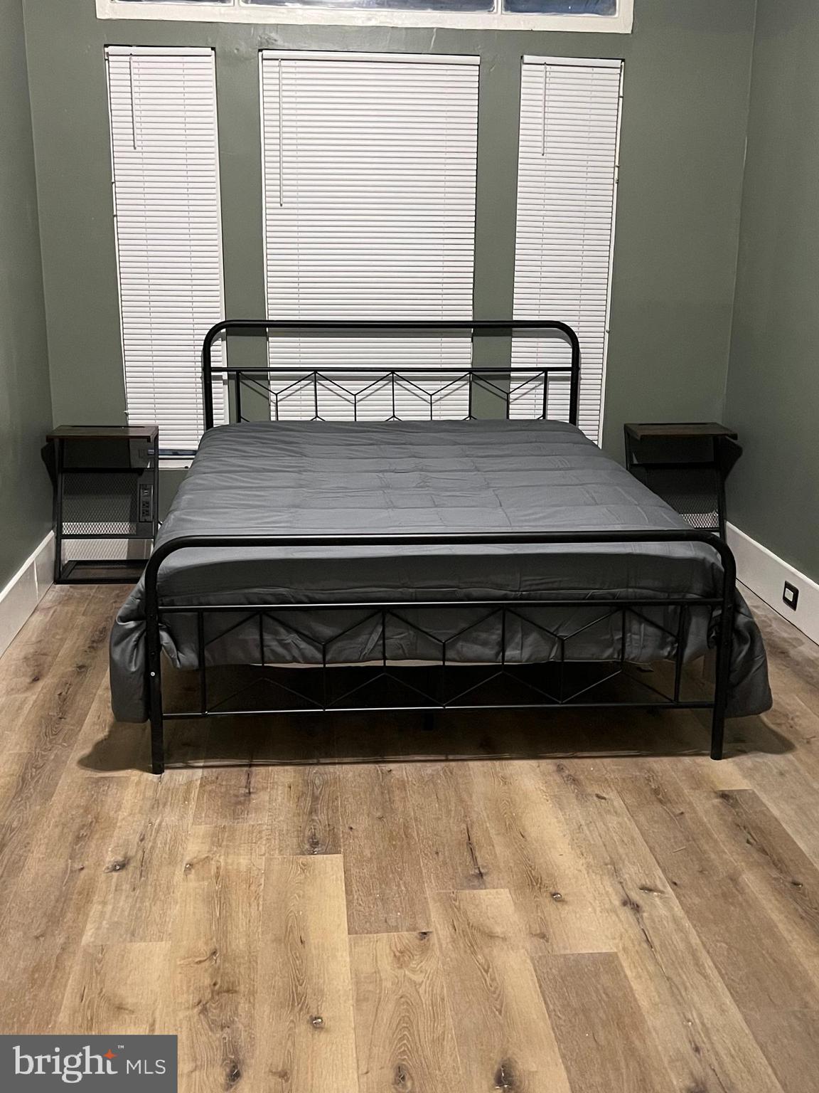 1402 Poplar Grove Street Baltimore, MD 21216 - Photo 4 of 15 a black and white photo of a bedroom