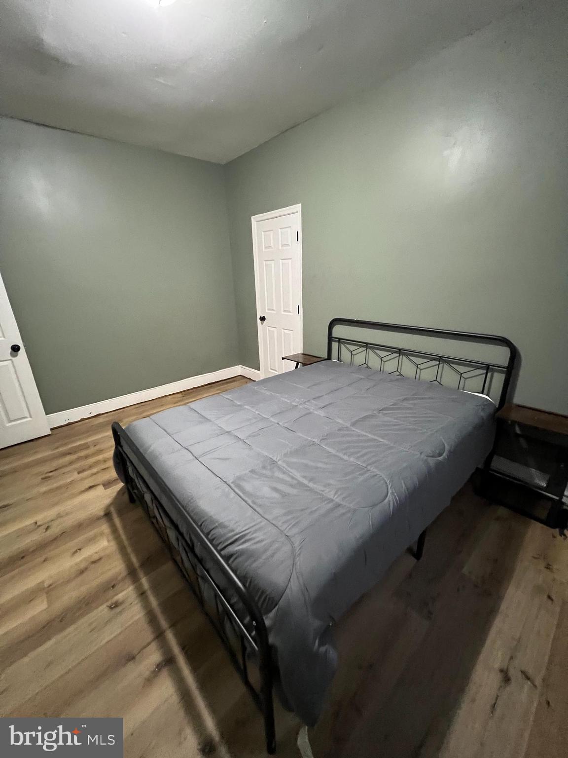 1402 Poplar Grove Street Baltimore, MD 21216 - Photo 9 of 15 a bedroom with a bed and window