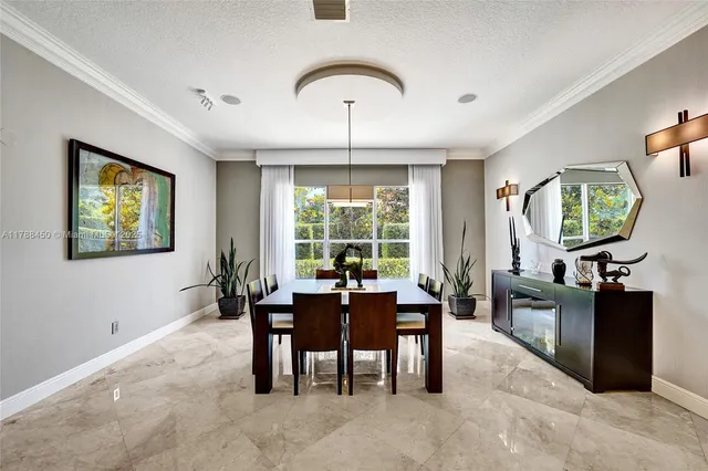 a large white kitchen with a large window