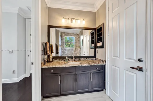 a view of a swimming pool with a garden and palm trees
