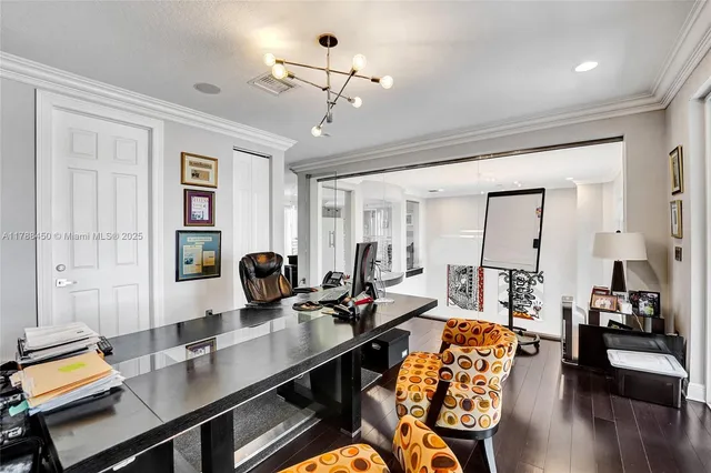 an aerial view of a house with garden space and street view