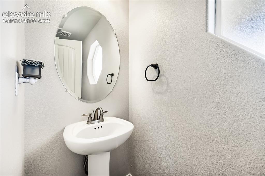 10202 Boulder Ridge Drive Peyton, CO 80831 - Photo 12 of 40 Main Level Half Bath