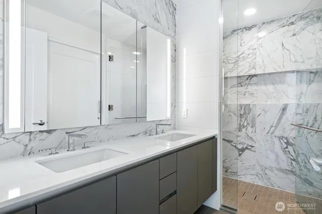 a bathroom with a sink toilet and mirror
