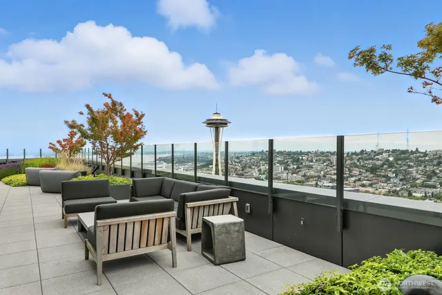 a balcony with furniture and a potted plant