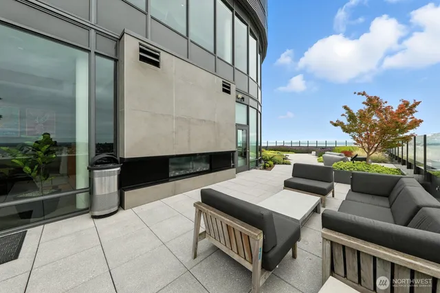 a view of kitchen with stainless steel appliances and cabinets