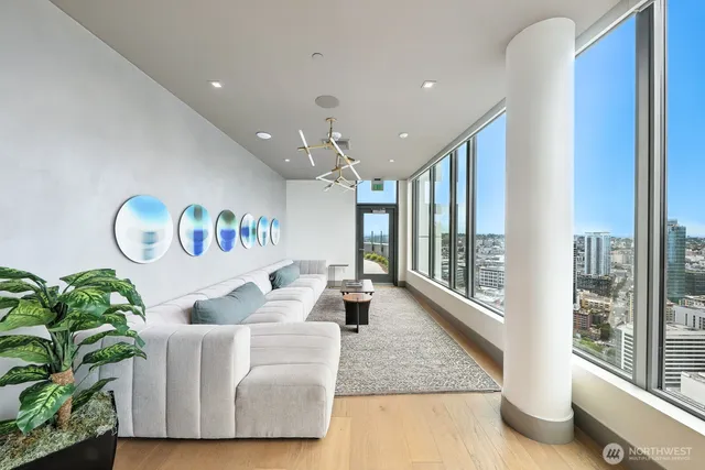 a kitchen with stainless steel appliances kitchen island granite countertop a refrigerator and microwave