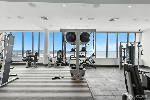 a room with gym equipment and a large window
