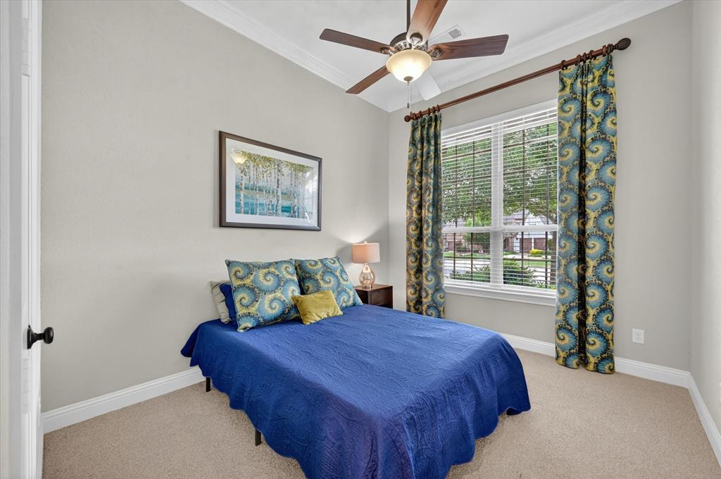 6656 Roughleaf Ridge Road Flower Mound, TX 76226 - Photo 25 of 40 a bedroom with a bed and a window