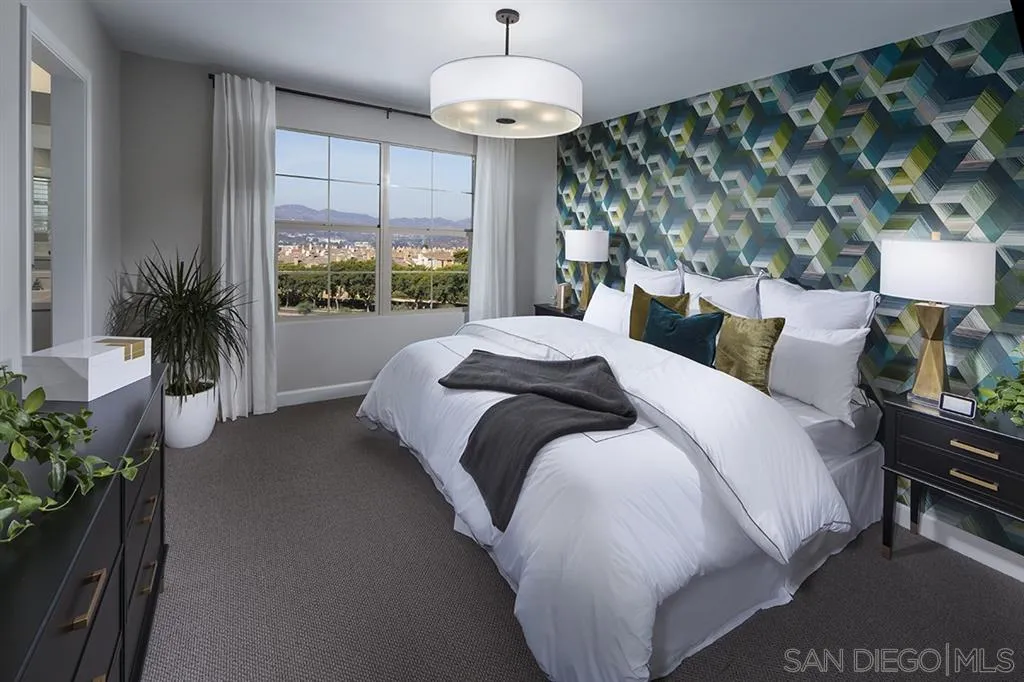 959 Slate San Marcos, CA 92078 - Photo 8 of 9 a bedroom with a large bed and a chandelier
