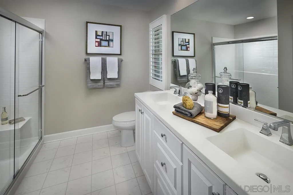 959 Slate San Marcos, CA 92078 - Photo 9 of 9 a bathroom with a sink and a mirror