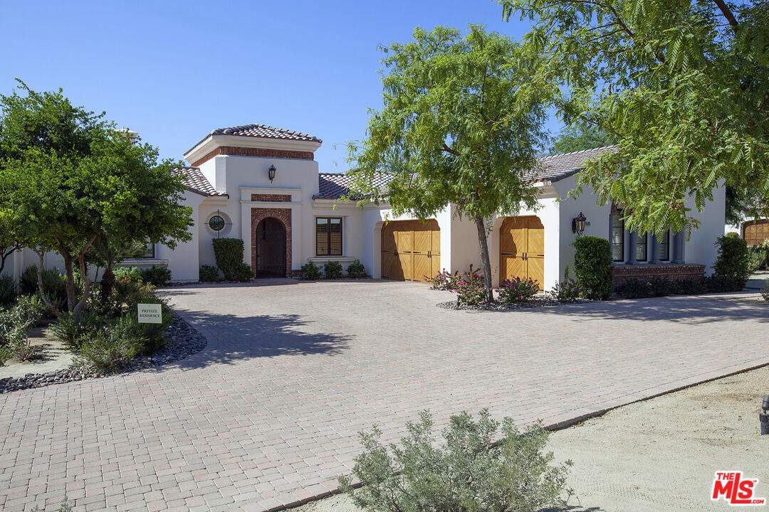 81805 Andalusia La Quinta, CA 92253 - Photo 1 of 45 a front view of a house with a yard