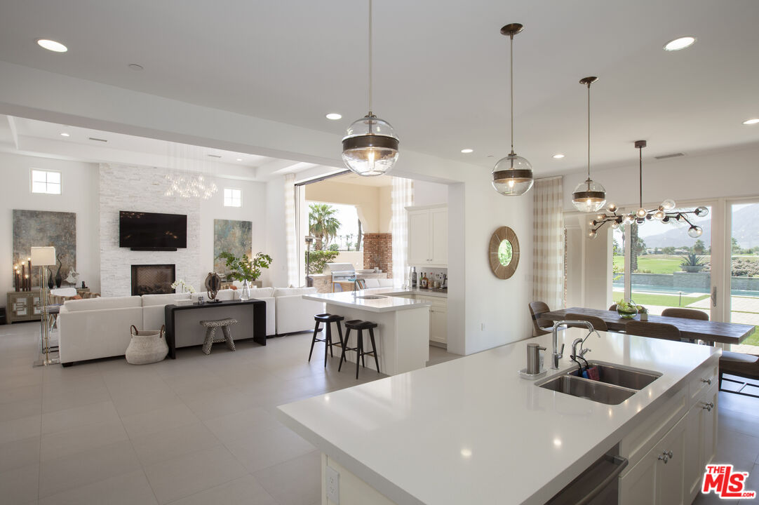 81805 Andalusia La Quinta, CA 92253 - Photo 11 of 45 a kitchen with counter space appliances and living room
