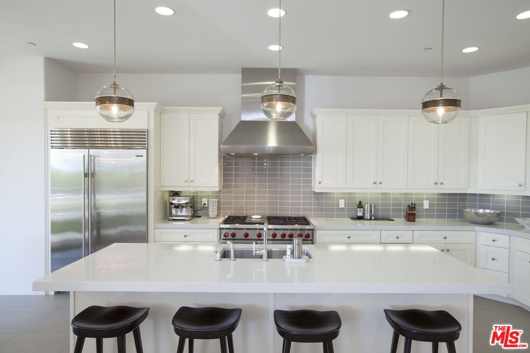 81805 Andalusia La Quinta, CA 92253 - Photo 14 of 45 a kitchen with cabinets a sink and chairs