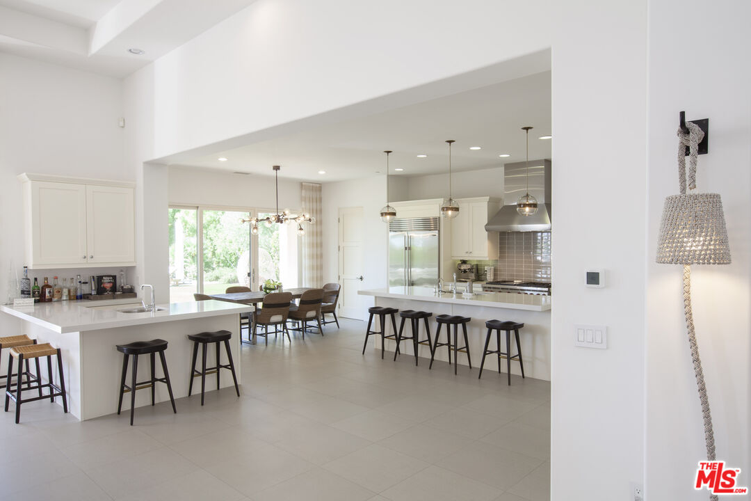 81805 Andalusia La Quinta, CA 92253 - Photo 16 of 45 a view of a dining room with furniture