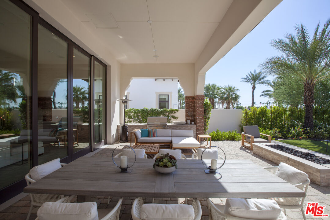 81805 Andalusia La Quinta, CA 92253 - Photo 18 of 45 a outdoor dining space with furniture and wooden floor