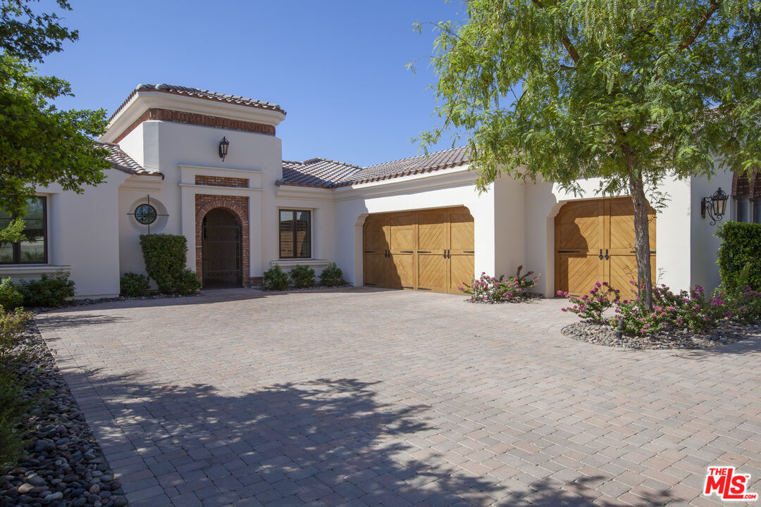 81805 Andalusia La Quinta, CA 92253 - Photo 2 of 45 a front view of a house with a yard