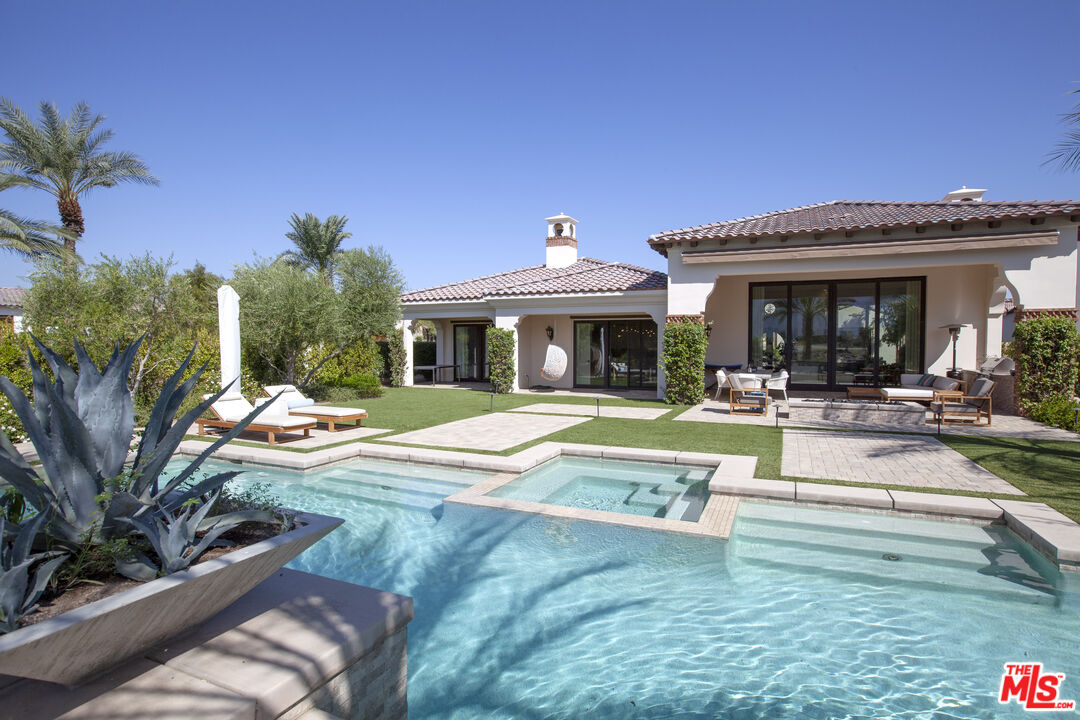 81805 Andalusia La Quinta, CA 92253 - Photo 21 of 45 a view of a house with swimming pool and sitting area