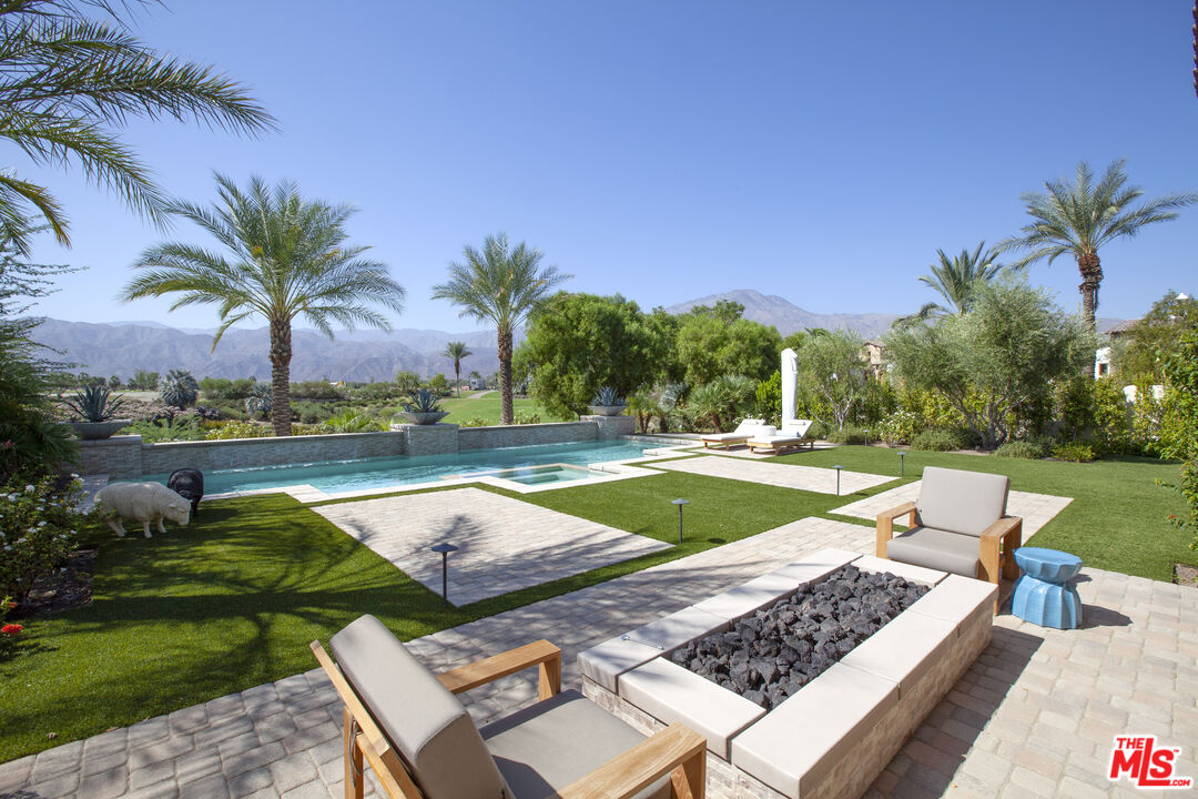 81805 Andalusia La Quinta, CA 92253 - Photo 22 of 45 a view of a swimming pool and lounge chairs