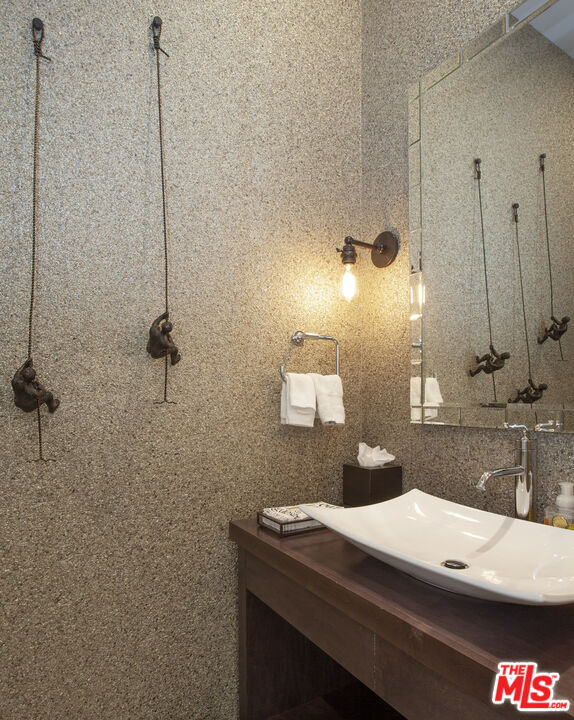 81805 Andalusia La Quinta, CA 92253 - Photo 25 of 45 a bathroom with a sink and a mirror