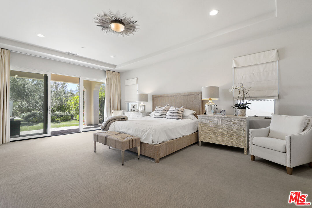 81805 Andalusia La Quinta, CA 92253 - Photo 26 of 45 a bed room with furniture and a large window