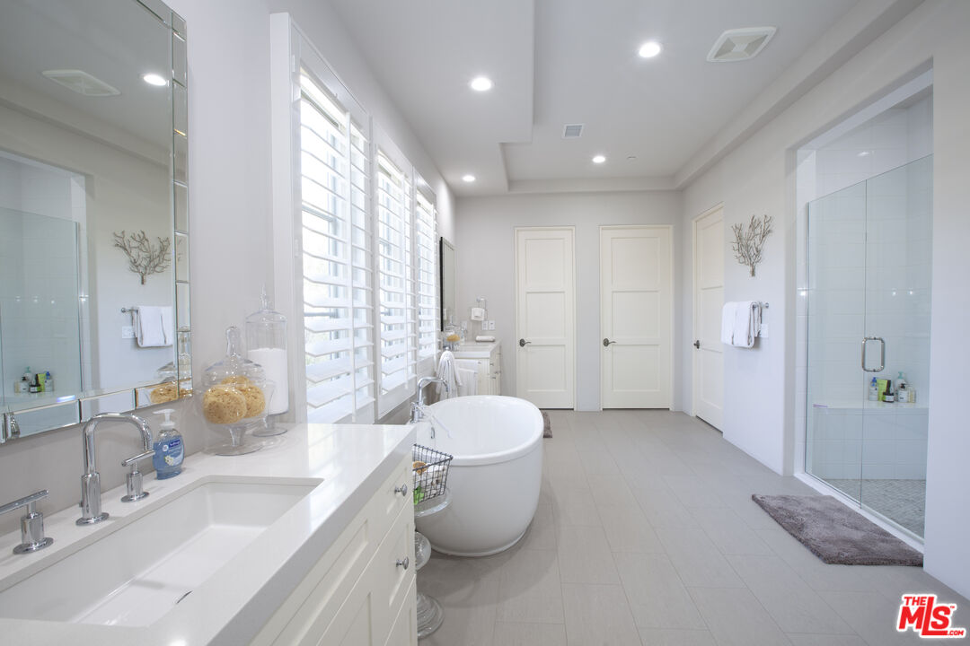 81805 Andalusia La Quinta, CA 92253 - Photo 29 of 45 a bathroom with a sink toilet and shower