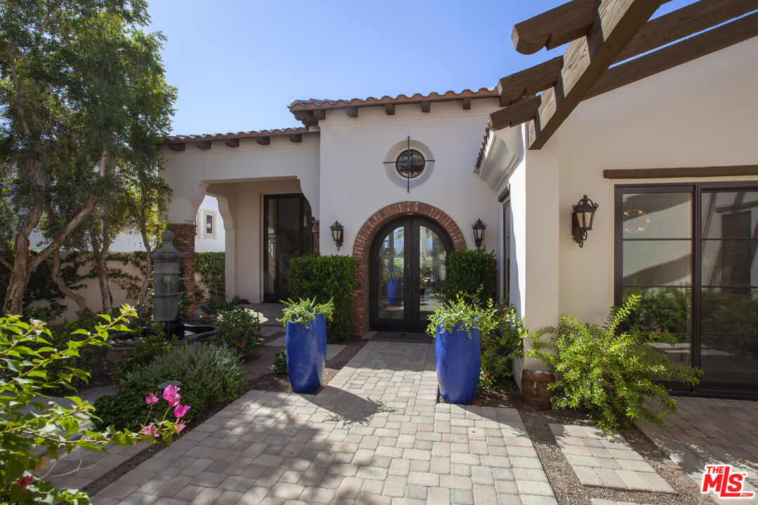 81805 Andalusia La Quinta, CA 92253 - Photo 3 of 45 a front view of a house with a garden