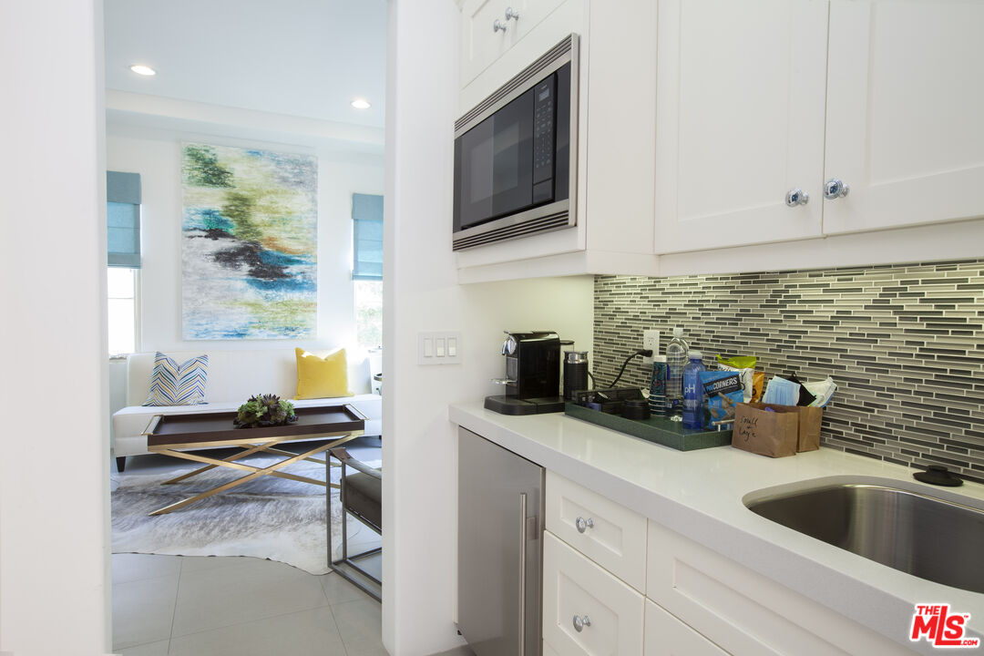 81805 Andalusia La Quinta, CA 92253 - Photo 32 of 45 a kitchen with a sink cabinets and window