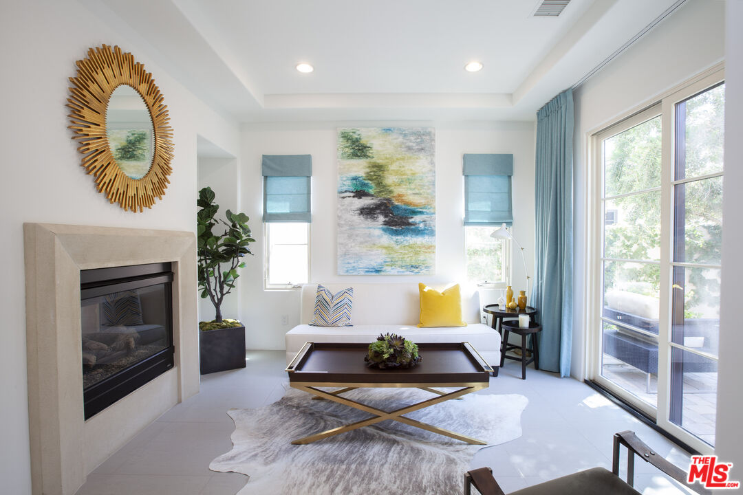 81805 Andalusia La Quinta, CA 92253 - Photo 34 of 45 a living room with furniture and a fireplace