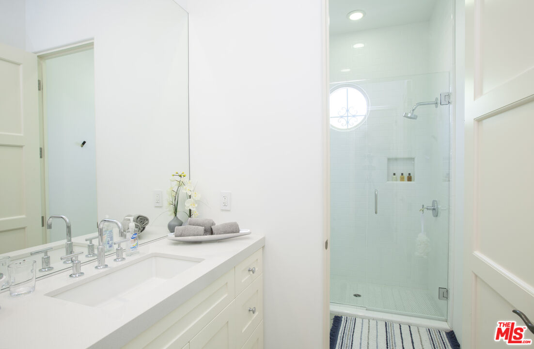 81805 Andalusia La Quinta, CA 92253 - Photo 36 of 45 a bathroom with a sink and a mirror