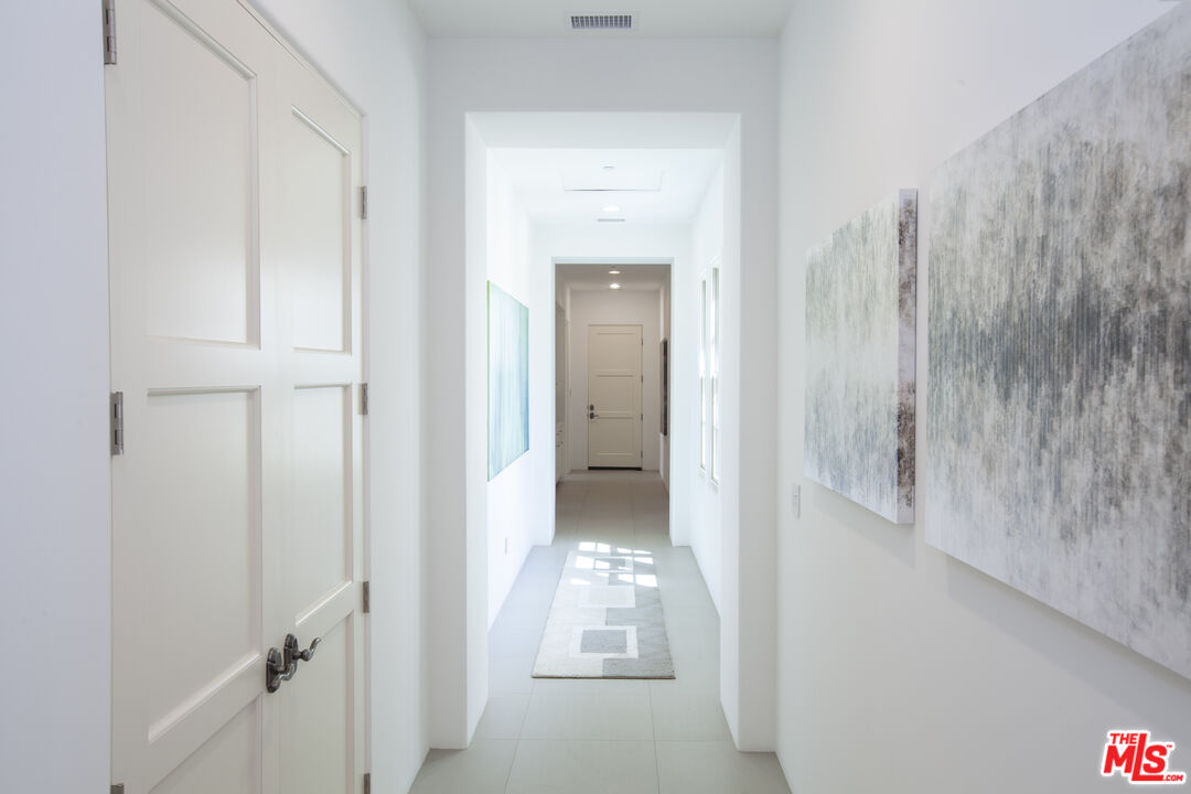 81805 Andalusia La Quinta, CA 92253 - Photo 37 of 45 a view of a hallway with white doors