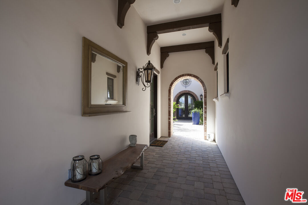 81805 Andalusia La Quinta, CA 92253 - Photo 4 of 45 a view of a hallway with entryway wooden floor and a dining room