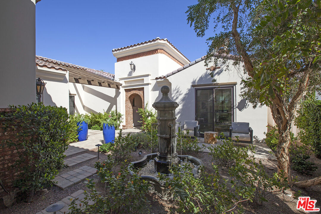 81805 Andalusia La Quinta, CA 92253 - Photo 5 of 45 front view of a house with a yard