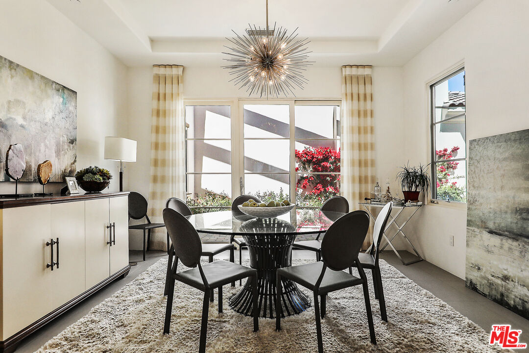 81805 Andalusia La Quinta, CA 92253 - Photo 10 of 45 a view of a dining room with furniture and a large window
