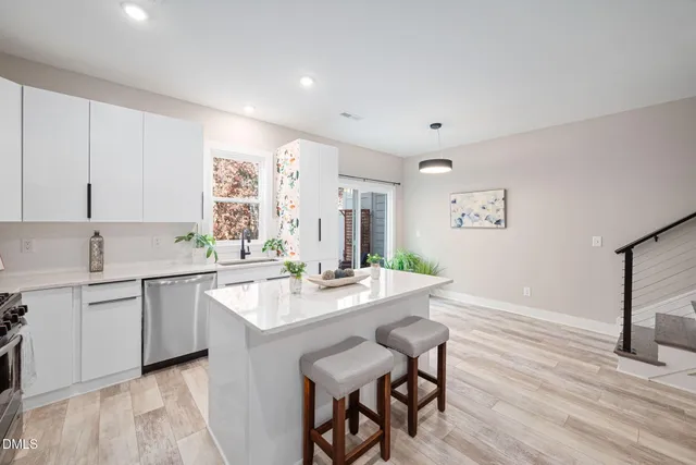 a kitchen with sink and cabinets