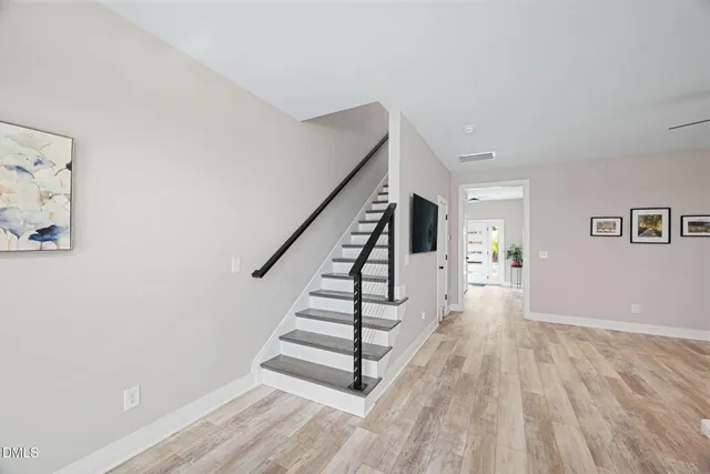 a view of entryway with wooden floor