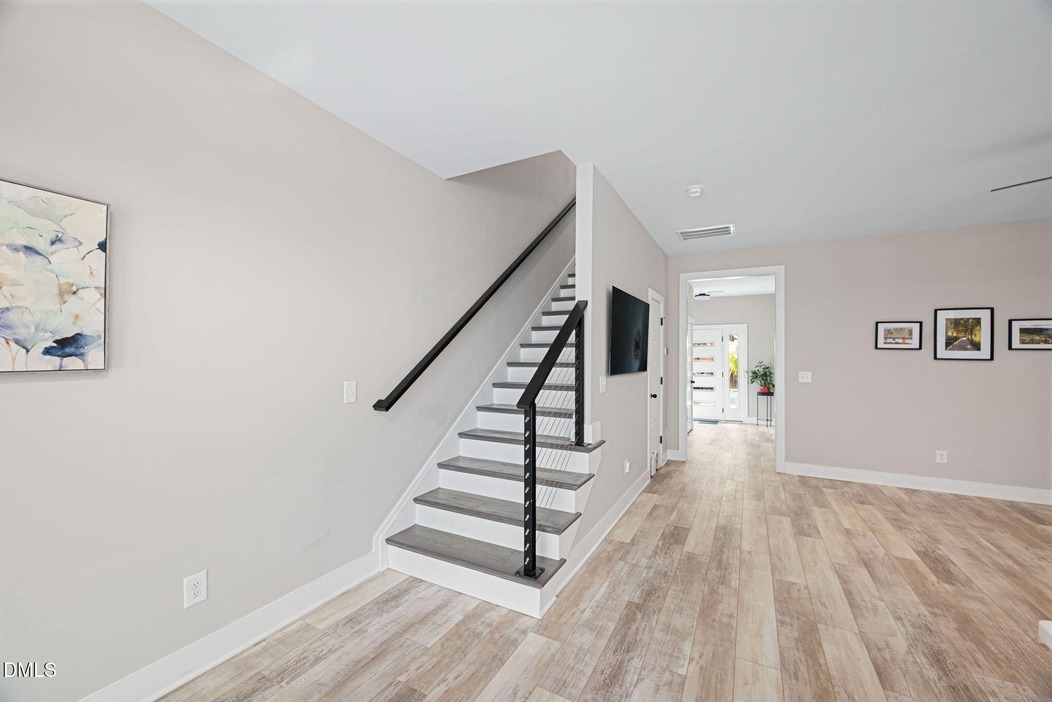 4208 Convergence Street Durham, NC 27704 - Photo 17 of 38 a view of entryway with wooden floor